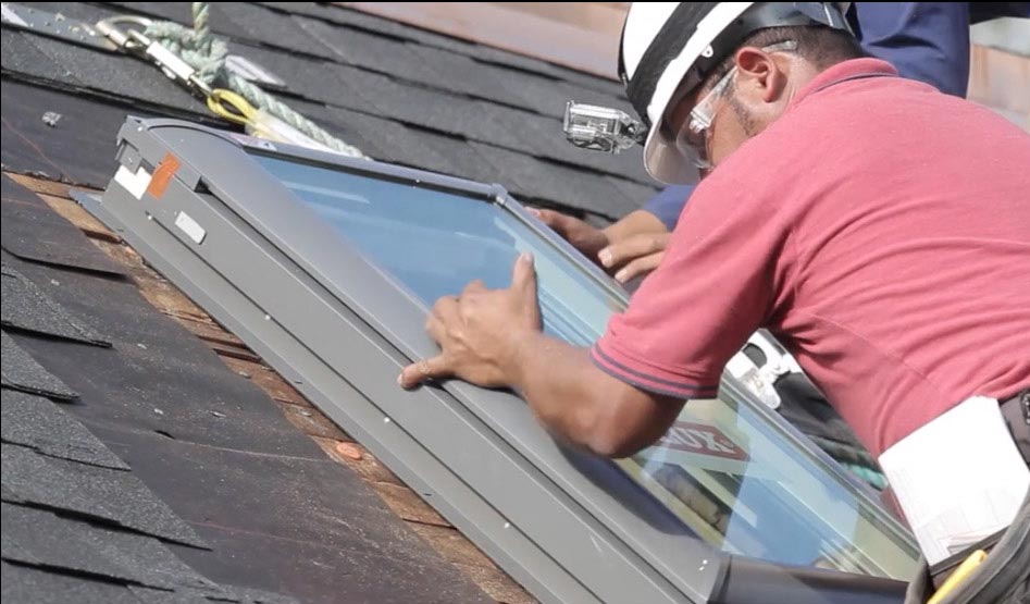 Technician installing a new skylight